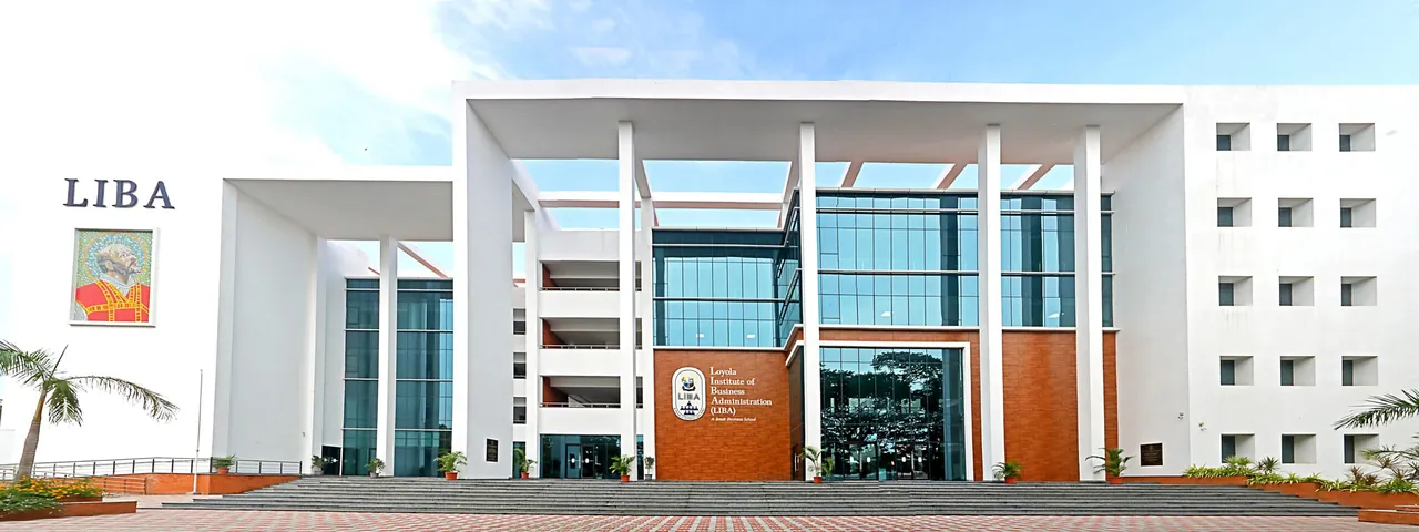 The front of the LIBA building, white with a glass and brick entrance, the LIBA name on the left wing
