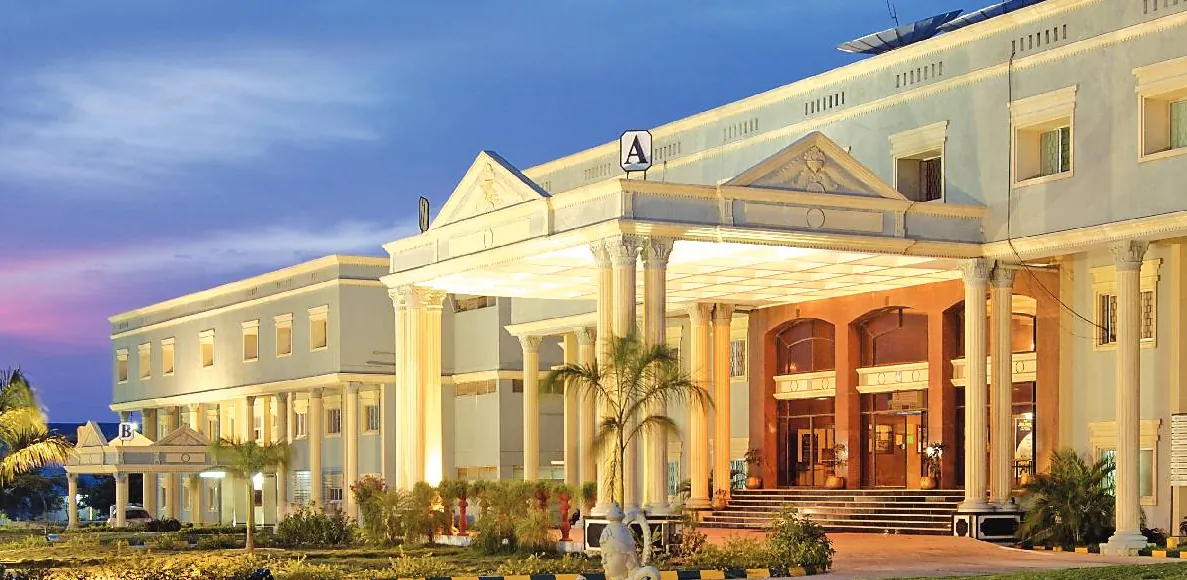The front of the main block of Sri Sairam Engineering College at dusk, with its columned entrance porch