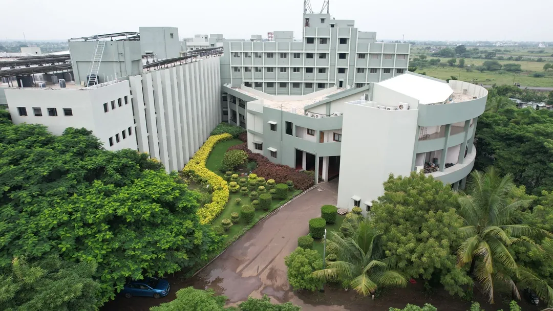 Aerial view of the Ashwini Rural Medical College buildings and garden forecourt, Kumbhari
