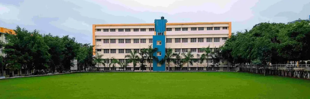 A Pimpri Chinchwad College of Engineering building seen across the campus ground (a wide 1400x450 home-page slide)